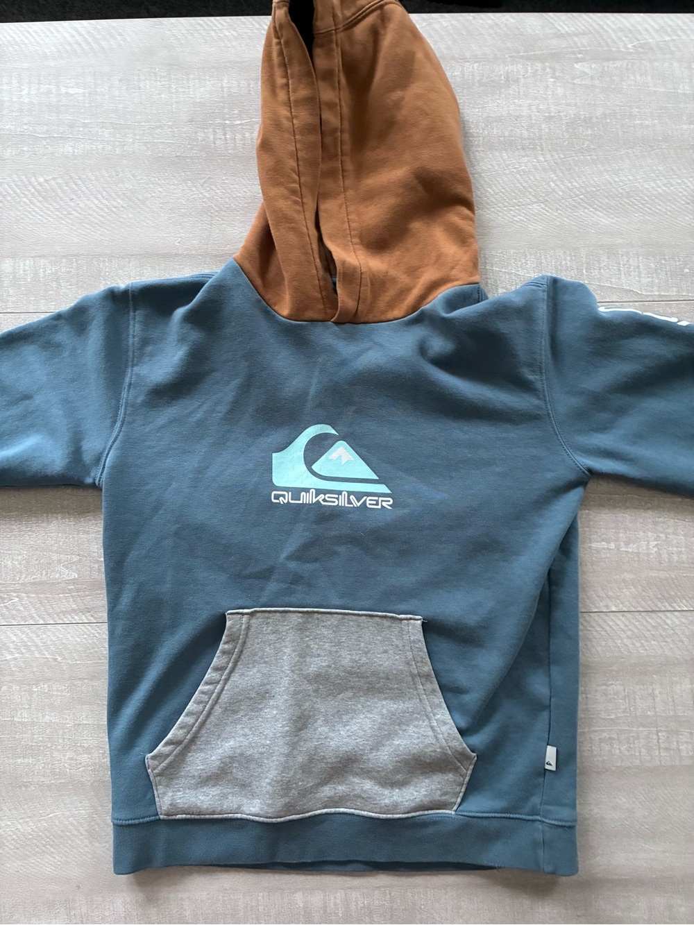 Quiksilver Blue Pullover Hoodie with Brown Hood and Gray Pocket